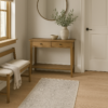 Traditional small rug styled in a classic entryway