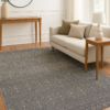 Modern area rug styled in a neutral-toned interior