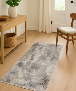 Small elegant rug styled in a traditional entryway