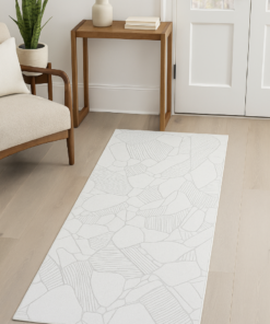 Neutral-toned runner rug styled in a hallway or entrance